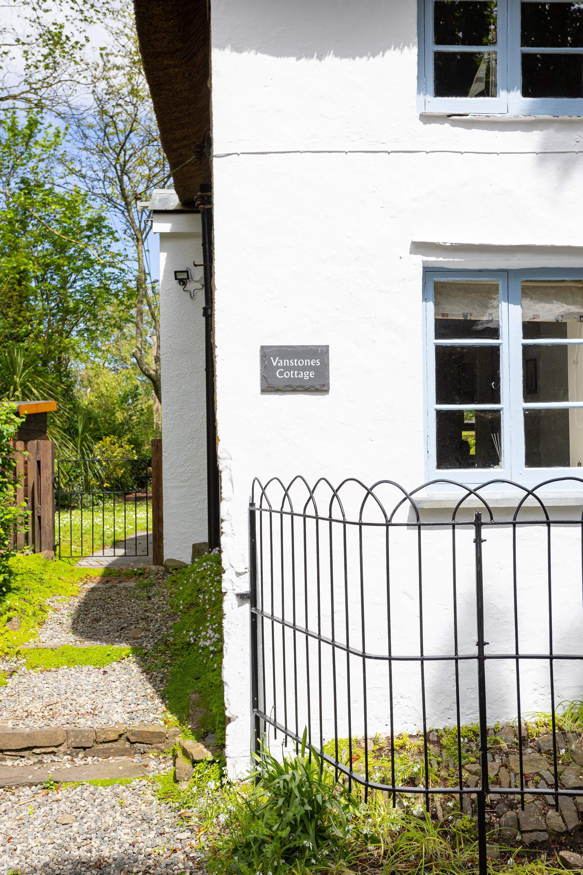 From the parking area follow the gravelled path to the back of the cottage which is the main door. 