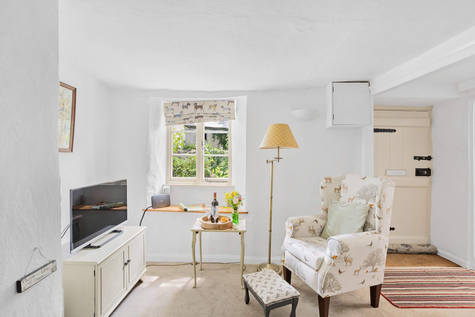 A cute sitting-room awaits.