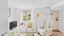 A cute sitting-room awaits.