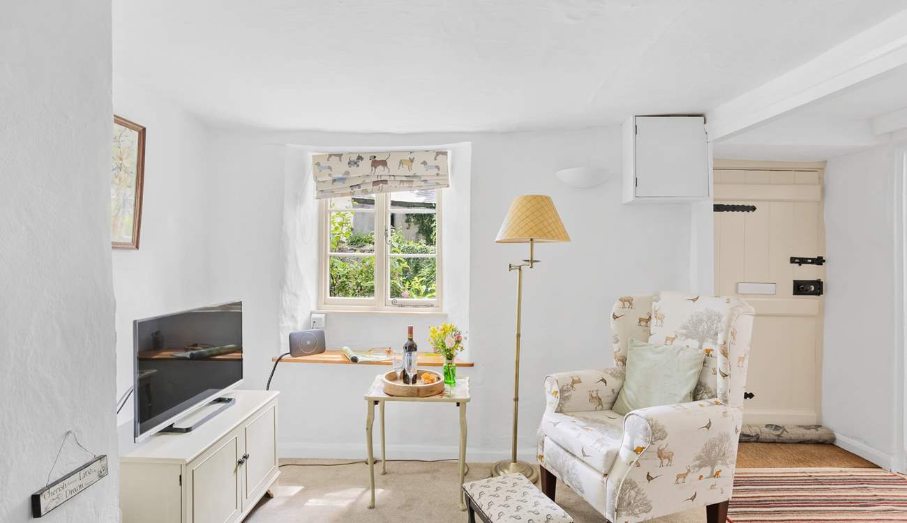 A cute sitting-room awaits.