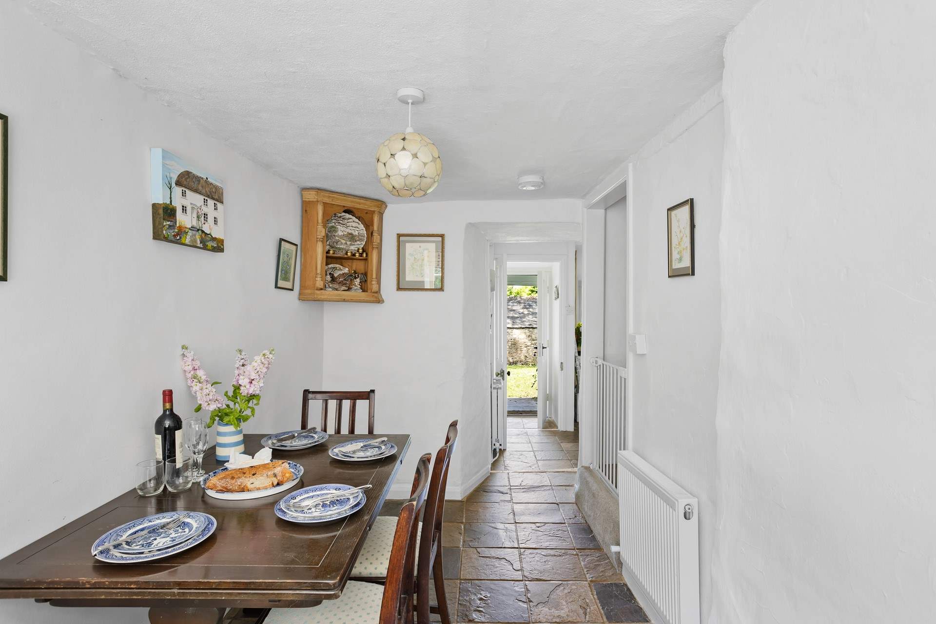 From the kitchen head through to the handy dining-room. This room has steep stairs leading to the bedrooms.