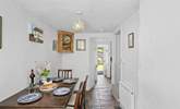 From the kitchen head through to the handy dining-room. This room has steep stairs leading to the bedrooms. - Thumbnail Image