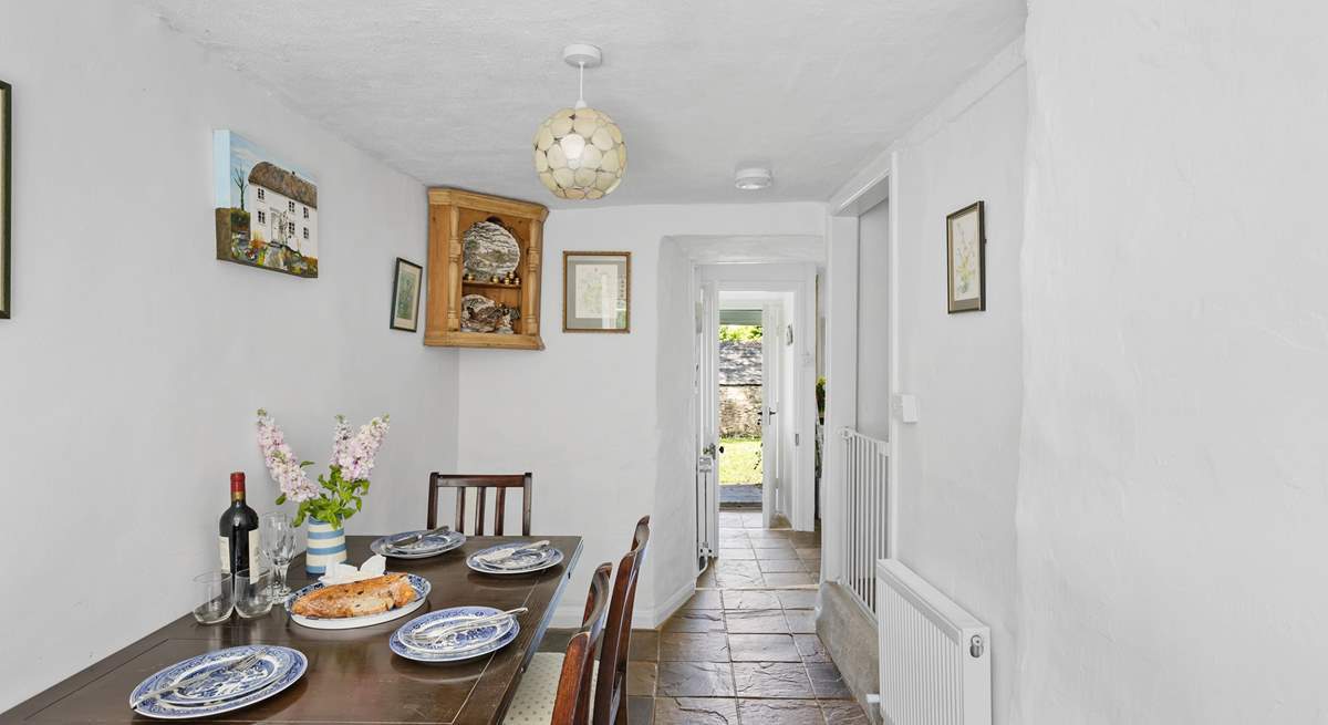 From the kitchen head through to the handy dining-room. This room has steep stairs leading to the bedrooms.