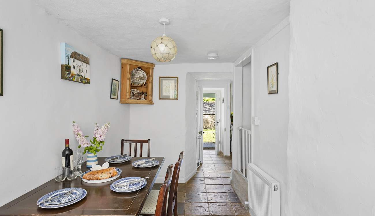 From the kitchen head through to the handy dining-room. This room has steep stairs leading to the bedrooms.