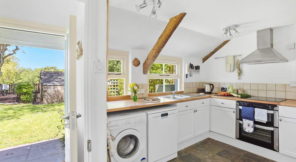 Enter through the back of the house into the fully equipped kitchen.