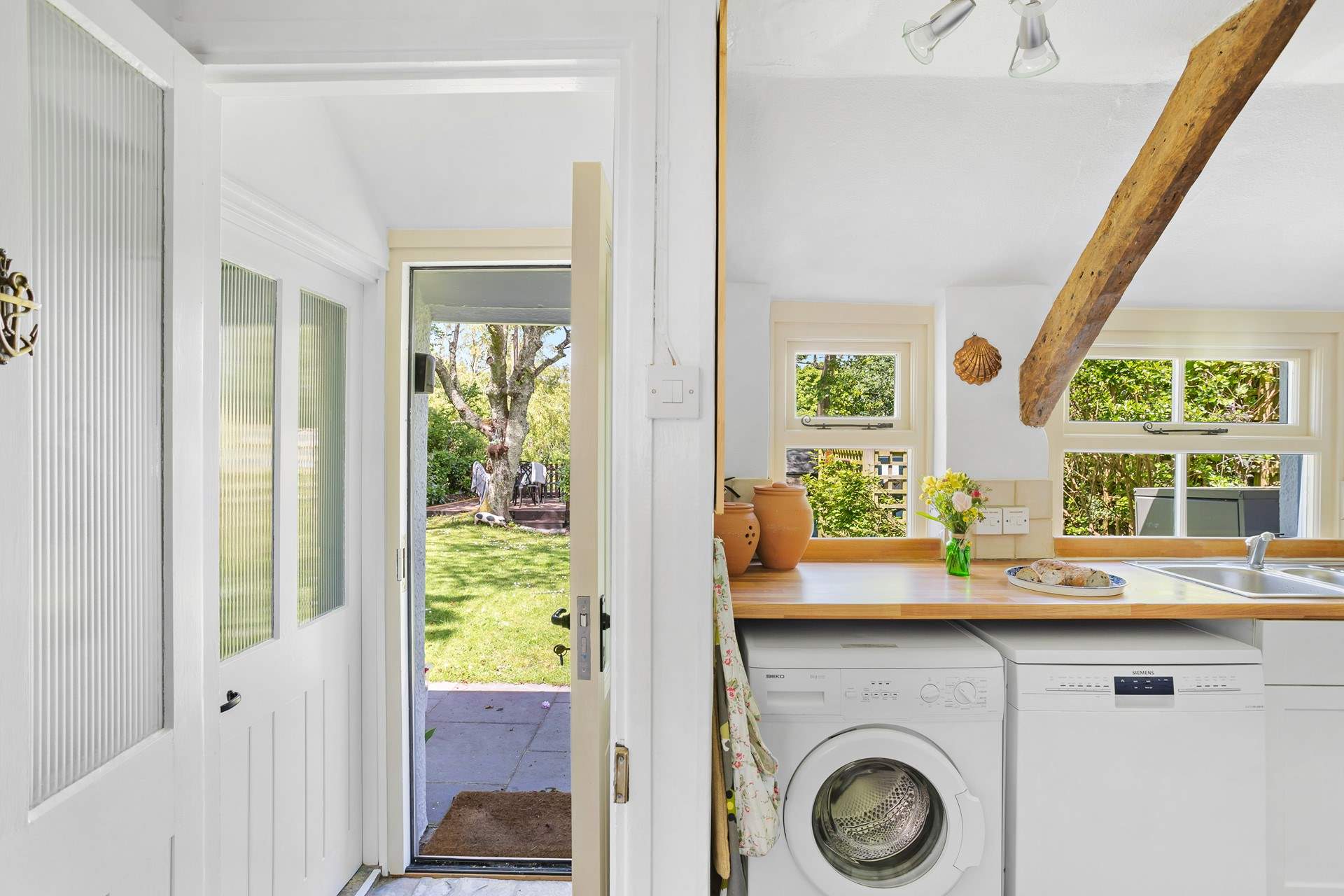 Time to enjoy a gorgeous cottage with a glorious garden. The door on the left is the downstairs bathroom.