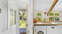 Time to enjoy a gorgeous cottage with a glorious garden. The door on the left is the downstairs bathroom.