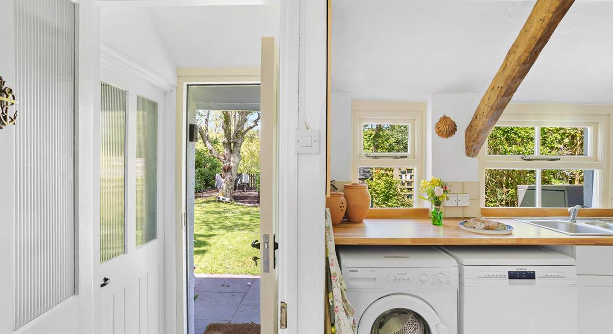 Time to enjoy a gorgeous cottage with a glorious garden. The door on the left is the downstairs bathroom.