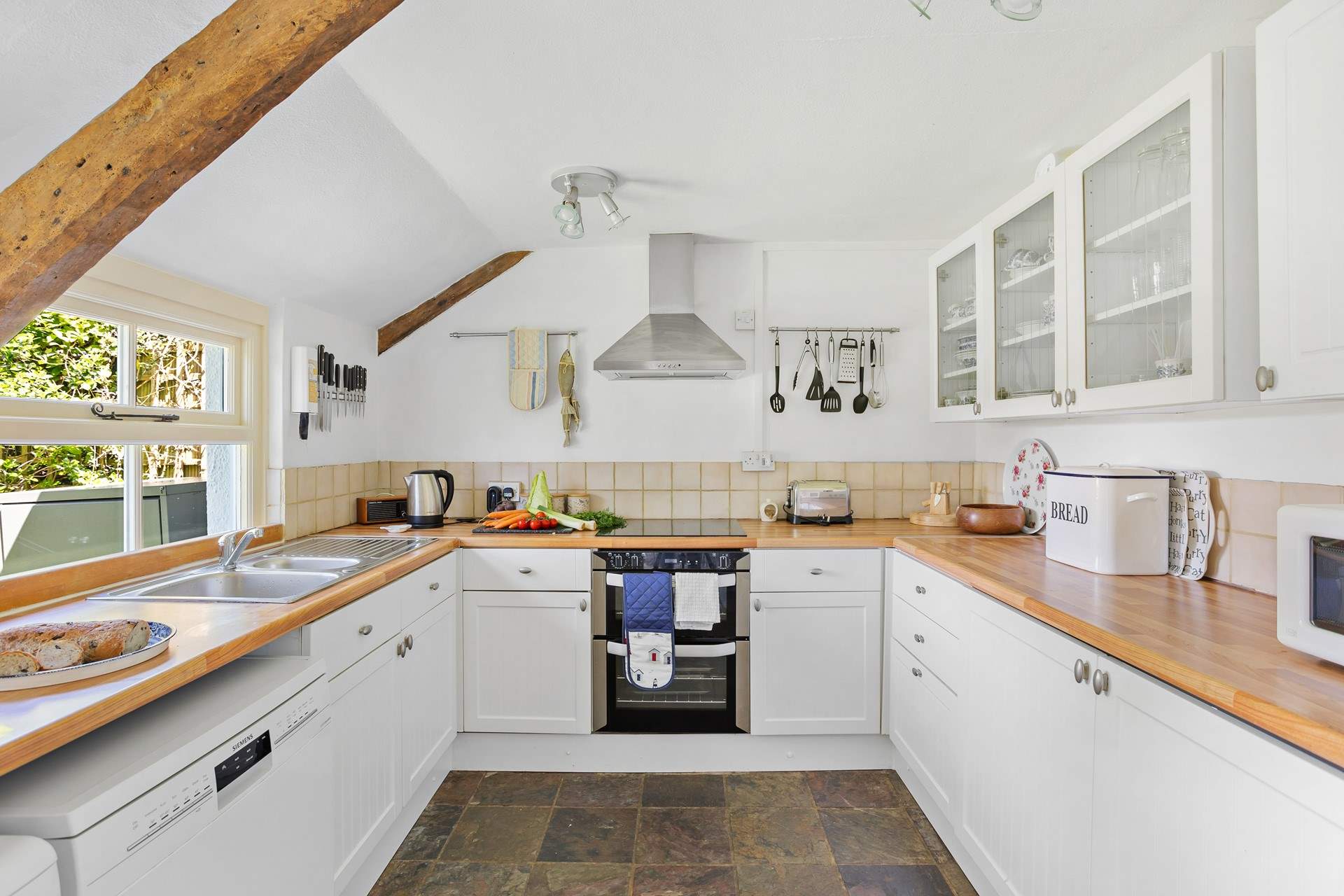 The cottage has had a sympathetic extension creating a modern fitted kitchen, the perfect spot to cook up a feast. 
