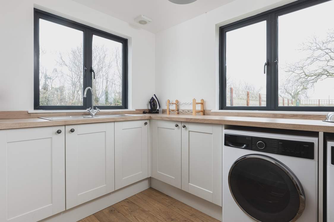 At the far end of the house you will find the utility-room with washing machine and tumble-drier.