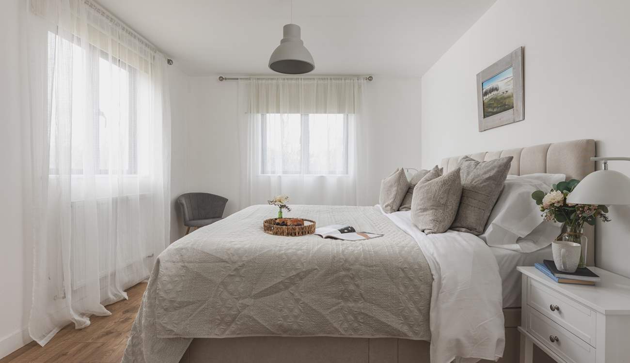 Bedroom one offers the flexibility of a 'zip and link' bed and also enjoys an en suite shower-room.