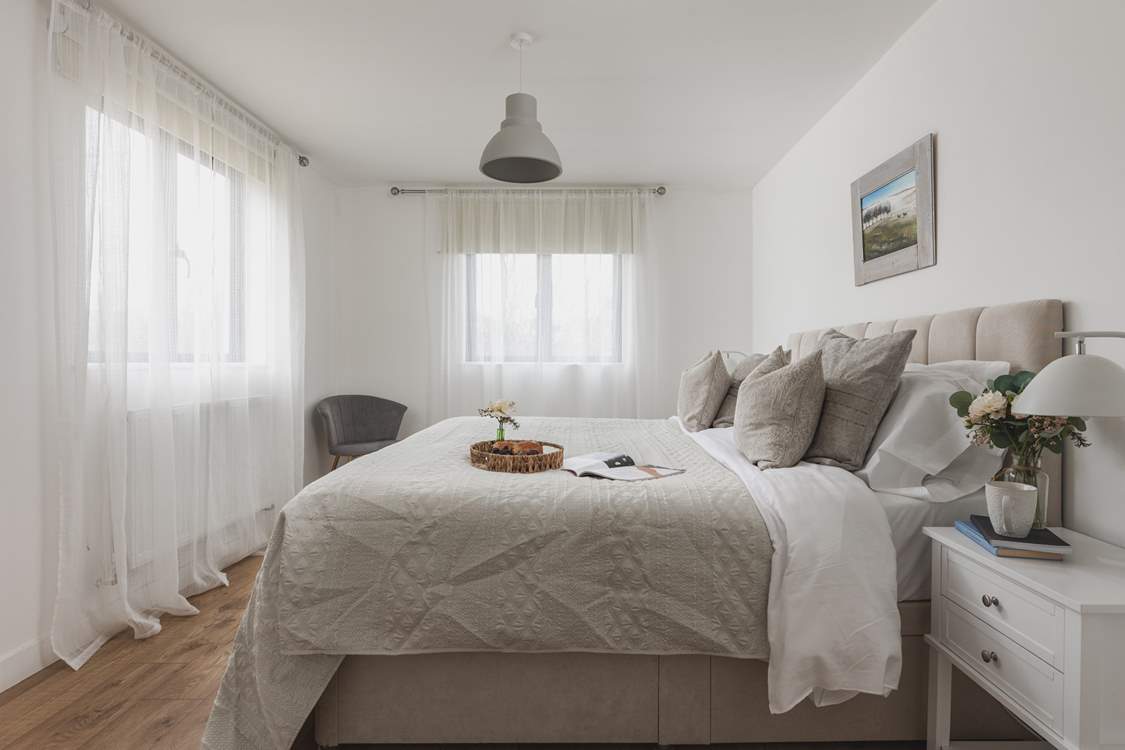 Bedroom one offers the flexibility of a 'zip and link' bed and also enjoys an en suite shower-room.