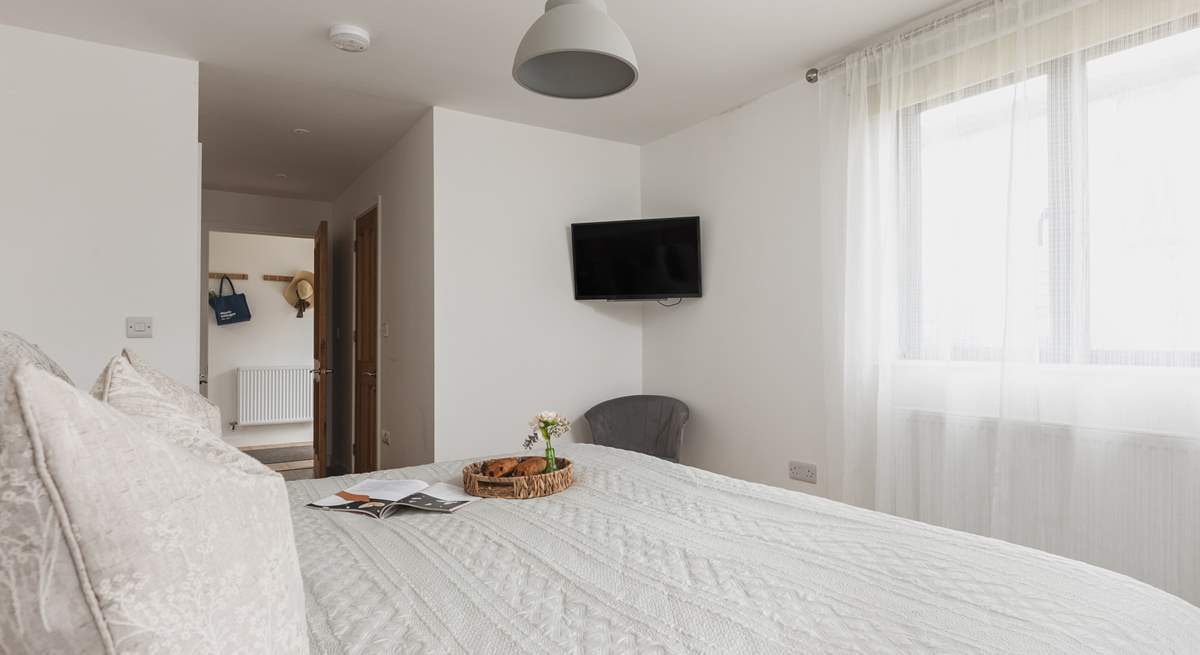 Bedroom one sits off the entrance hall and benefits from an en suite shower-room and Smart TV.