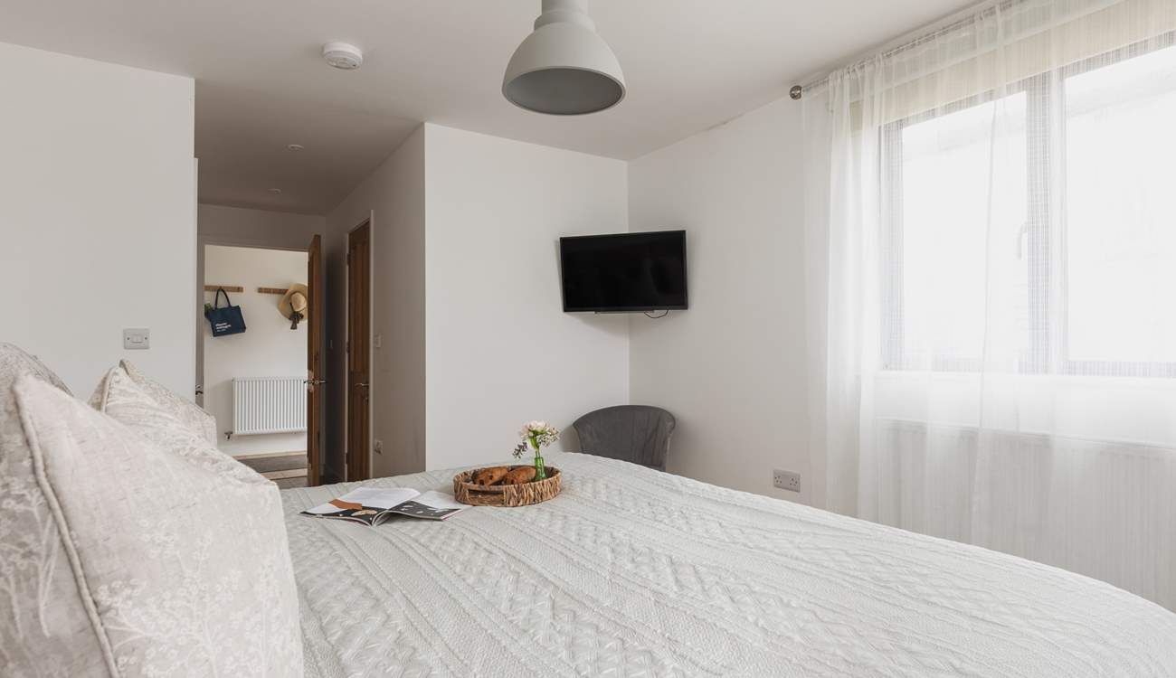 Bedroom one sits off the entrance hall and benefits from an en suite shower-room and Smart TV.