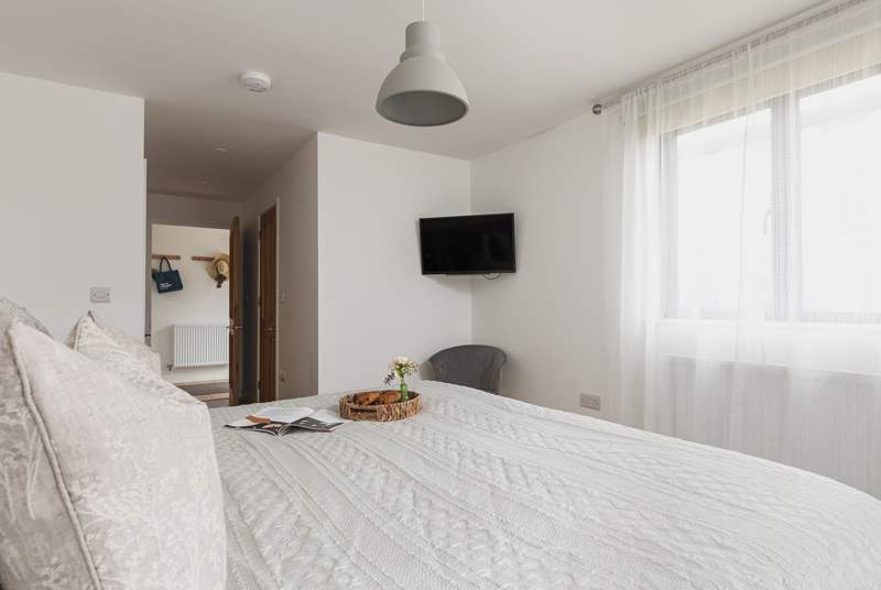 Bedroom one sits off the entrance hall and benefits from an en suite shower-room and Smart TV.