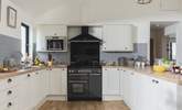 The kitchen is fully equipped, perfect for cooking up a family feast. - Thumbnail Image