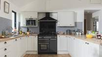 The kitchen is fully equipped, perfect for cooking up a family feast.