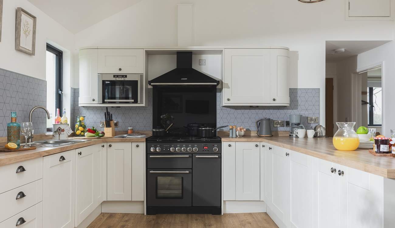 The kitchen is fully equipped, perfect for cooking up a family feast.