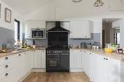 The kitchen is fully equipped, perfect for cooking up a family feast.