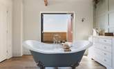 Enjoy a long soak in the wonderful roll-top bath. - Thumbnail Image