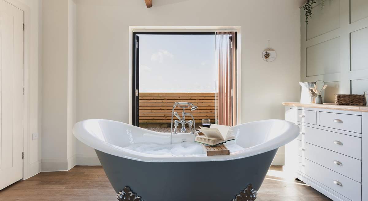 Enjoy a long soak in the wonderful roll-top bath.