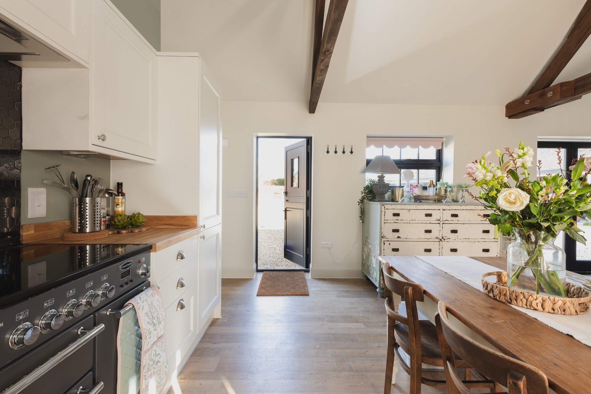 The front stable-door leads out to the parking-area.