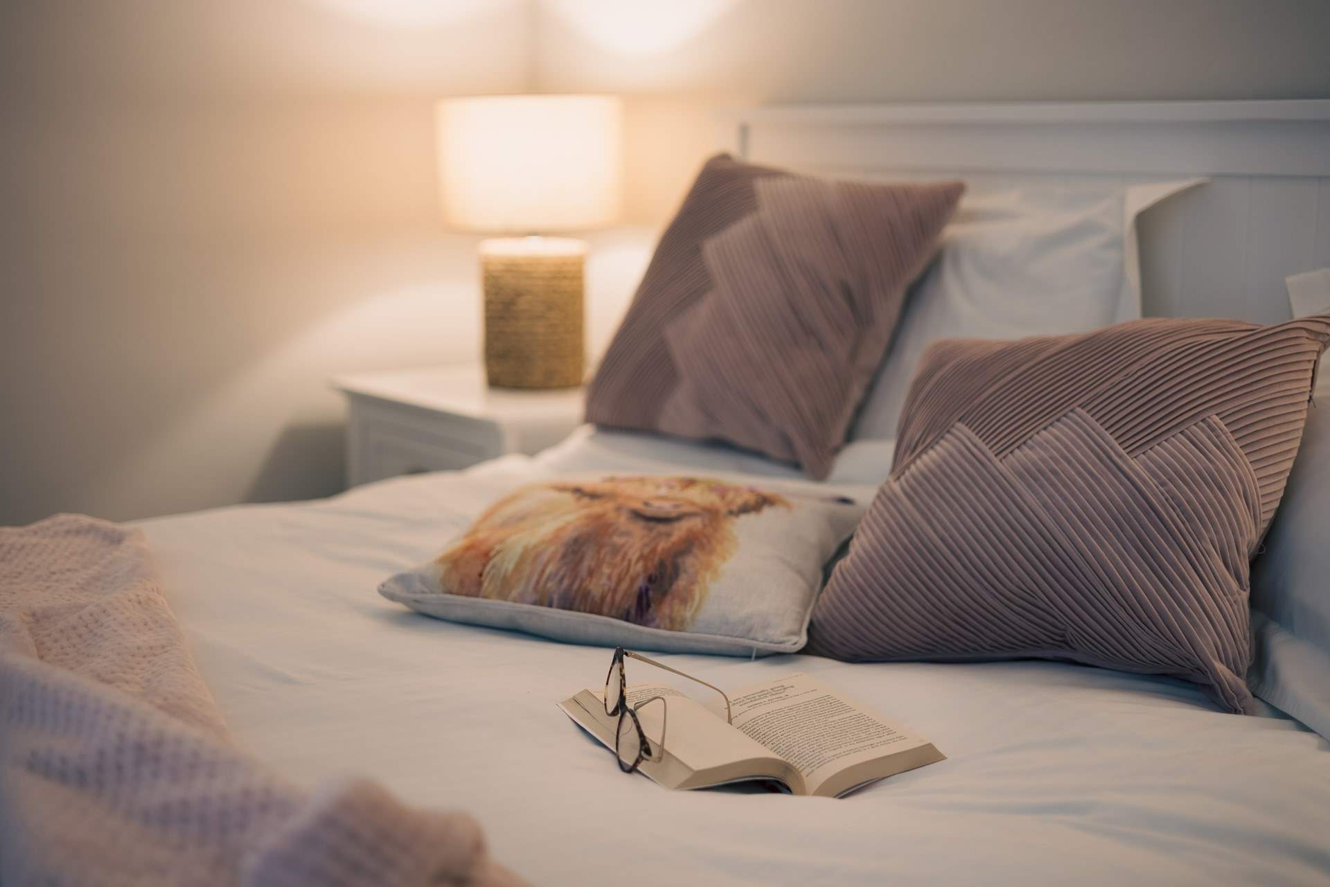 The king-sized bed awaits you in this beautiful room.