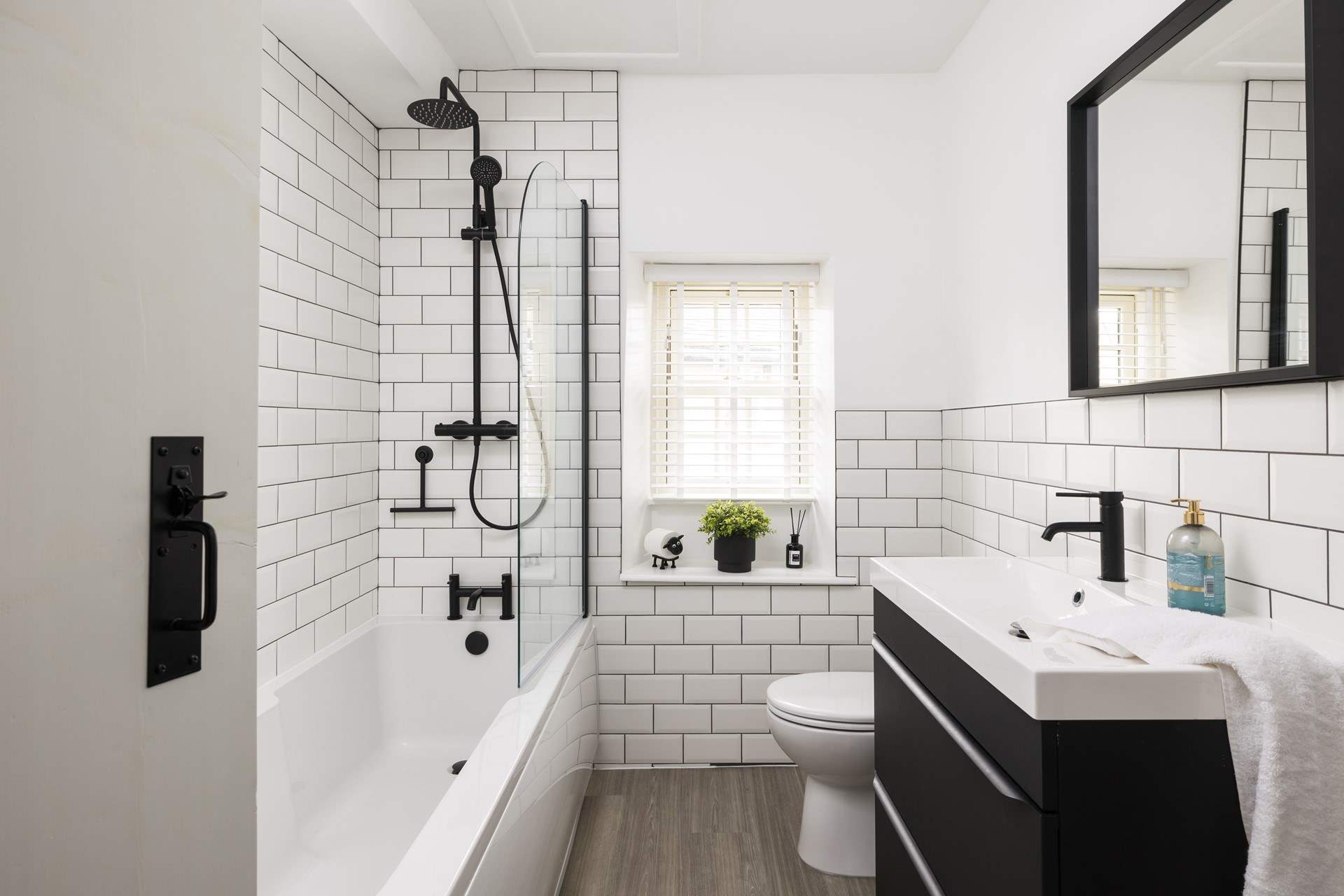 The contemporary bathroom has a bath for long leisurely soaks.