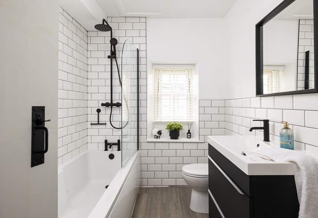 The contemporary bathroom has a bath for long leisurely soaks.