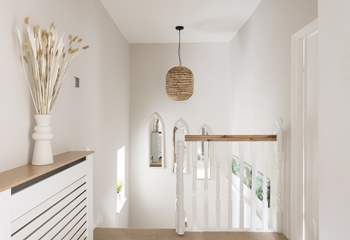 Walk up the light filled staircase to bed after a full day exploring.