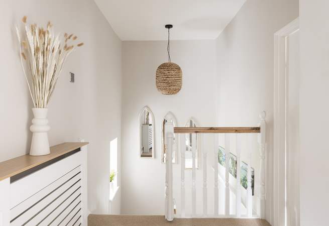 Walk up the light filled staircase to bed after a full day exploring.