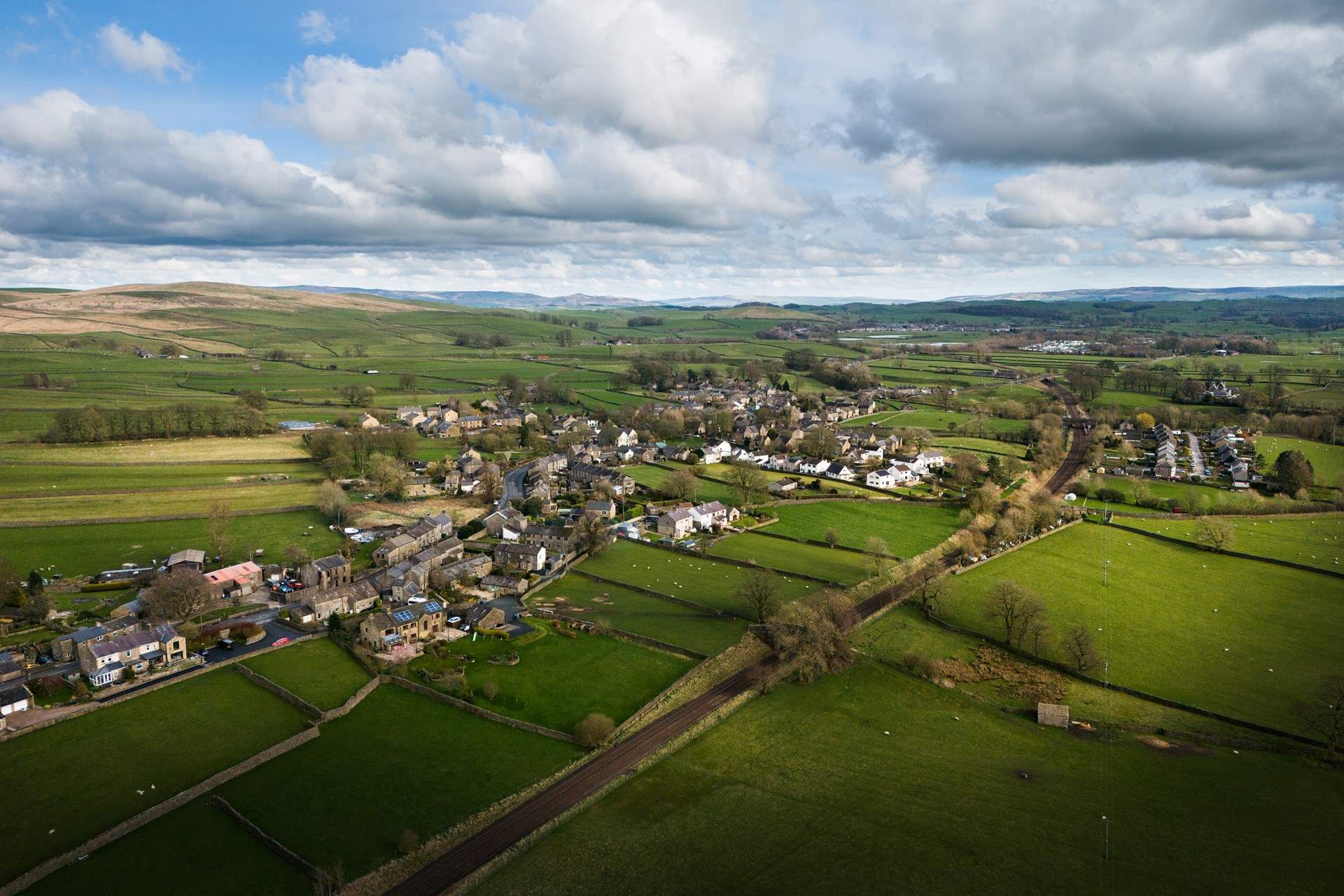 The Yorkshire village from the air, with the hills in the background.