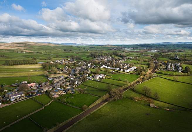 The Yorkshire village from the air, with the hills in the background.