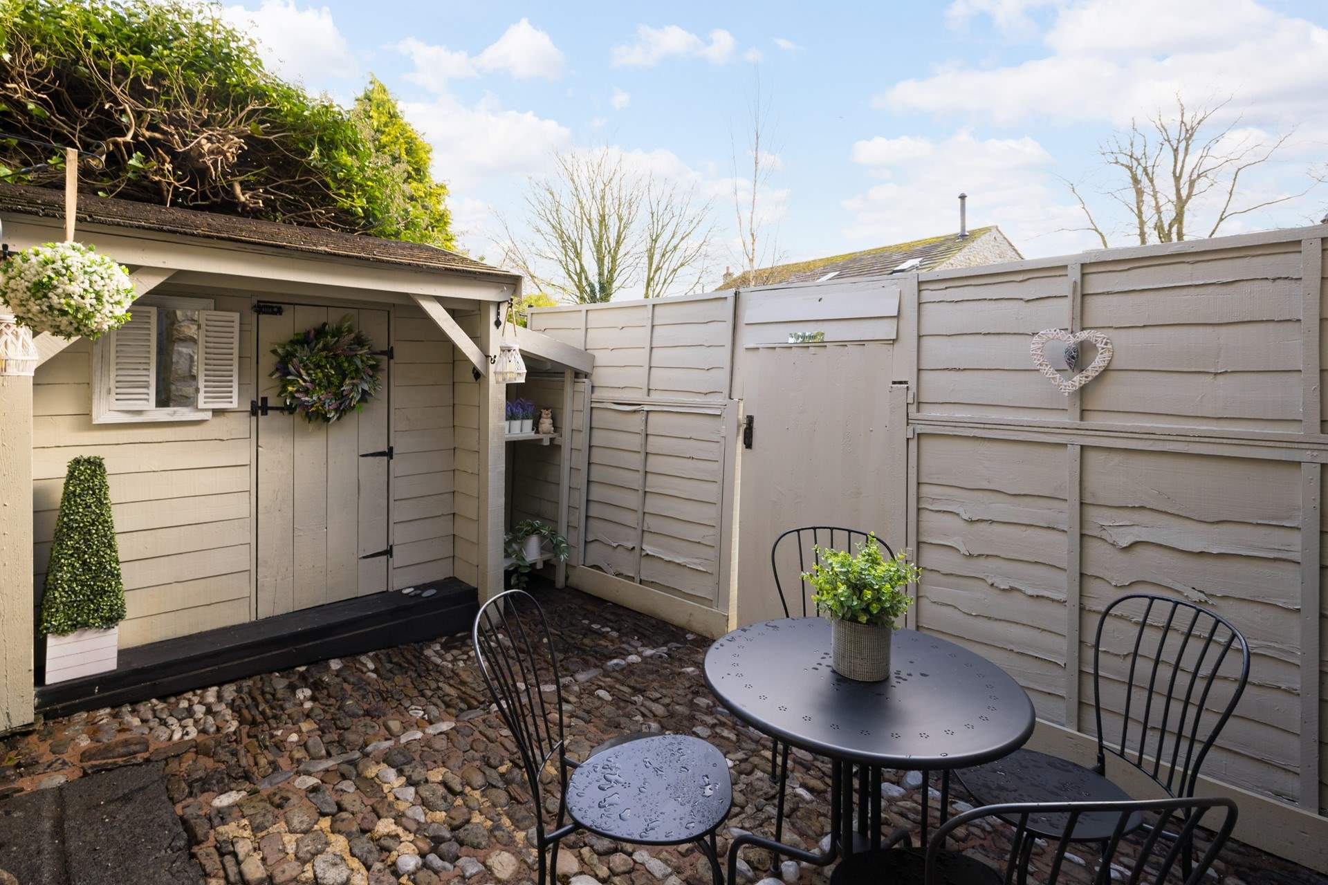 The rear courtyard is ideal for sipping your drink at any time of day.