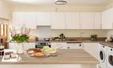 This modern kitchen is fully equipped for all your culinary needs. - Thumbnail Image