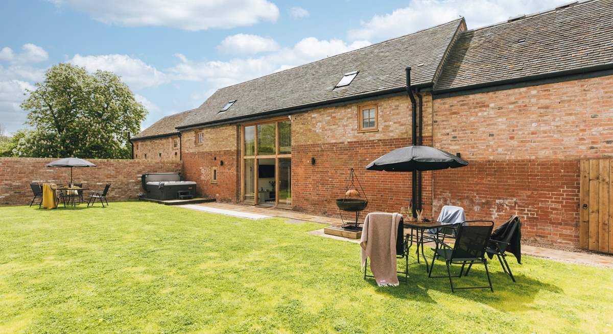 Relax in the hot tub before a barbeque on the fire pit. 