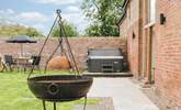 Why not cook up a feast in this fabulous barbecue, complete with wok attachment. - Thumbnail Image