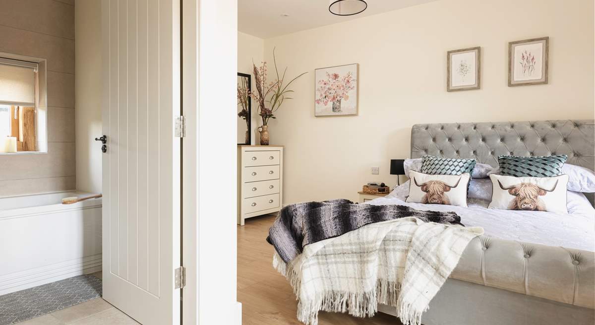 The downstairs bedroom is sumptuous and inviting. 