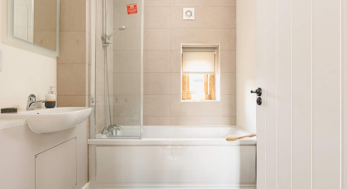 Unwind with a soak in the ground floor bedroom's en suite.