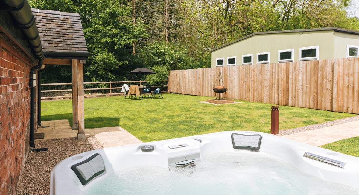 Indulge in the hot tub and enjoy your beautiful private garden.