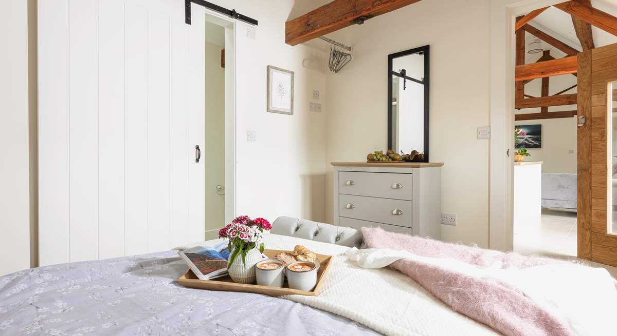 We just love the traditional sliding barn doors to the en suite.