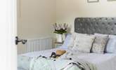 Pretty bed linen suits this cottage perfectly. - Thumbnail Image