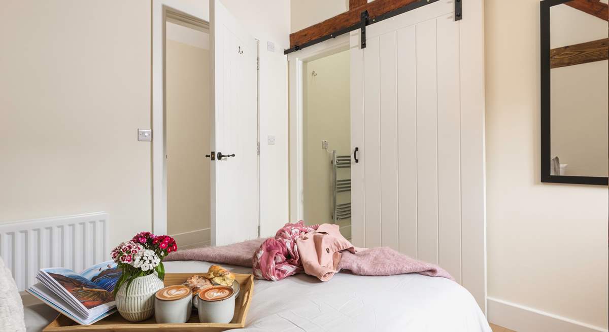 Stylish barn style doors in the single bedroom, lending a rustic ambiance.