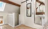 Sleek barn doors lead into the en suite shower-room.  - Thumbnail Image