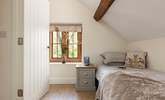 Beautiful original beams adorn the bedroom.  - Thumbnail Image