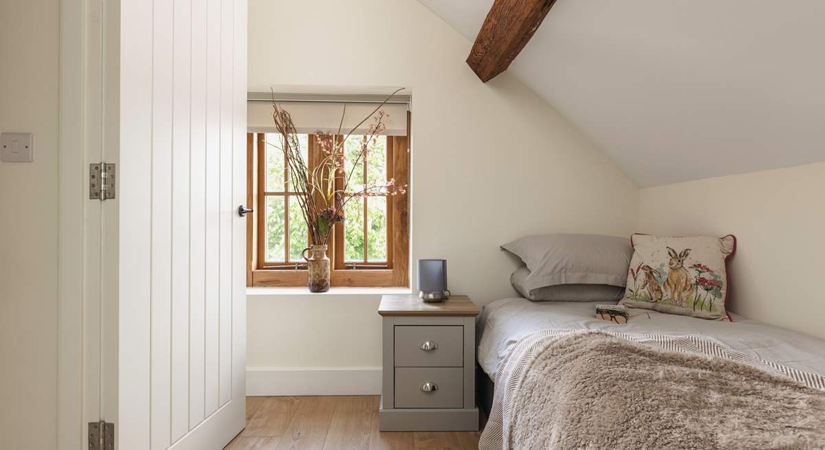 Beautiful original beams adorn the bedroom. 