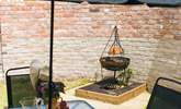 Cook up a storm on the fire-pit barbecue. - Thumbnail Image