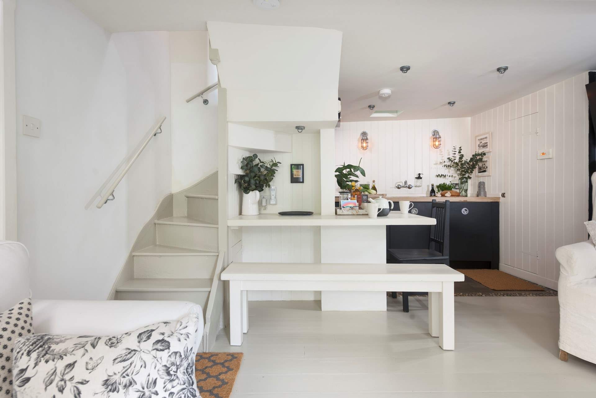 A turning wooden (steep in places) staircase takes you up to the bedrooms and shower-room. Please take care on the stairs. We suggest bringing along a pair of non slip socks or slippers to wear indoors. 