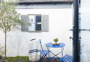 Guests in bedroom one can enjoy a peaceful morning coffee outside. 