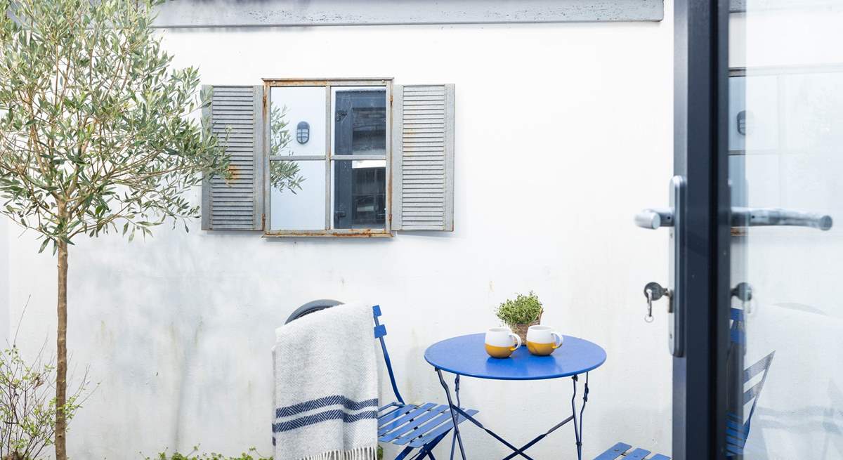 Guests in bedroom one can enjoy a peaceful morning coffee outside. 